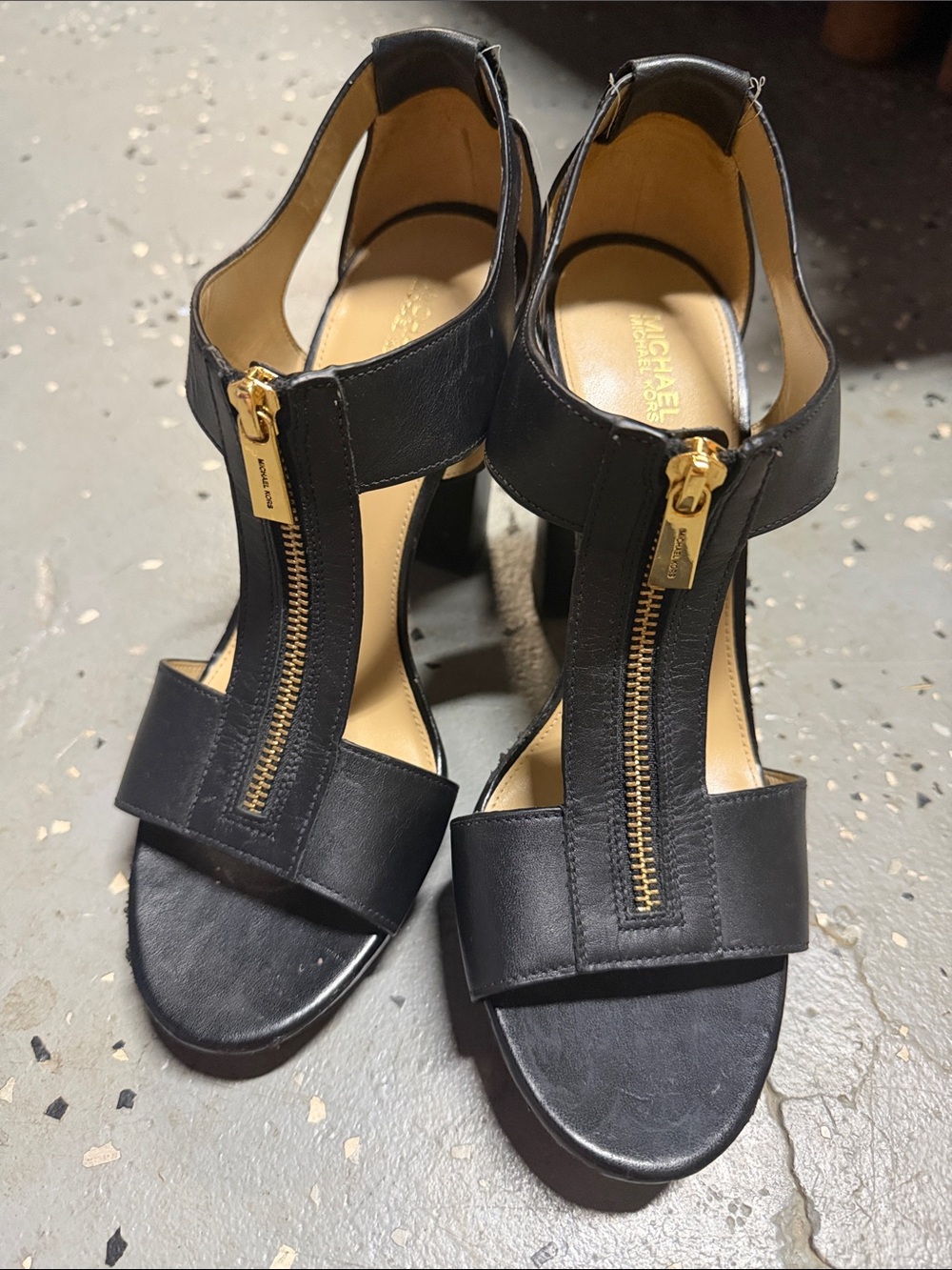 MICHAEL Michael Kors Black Leather T-Strap Heels with Gold Zipper Accent